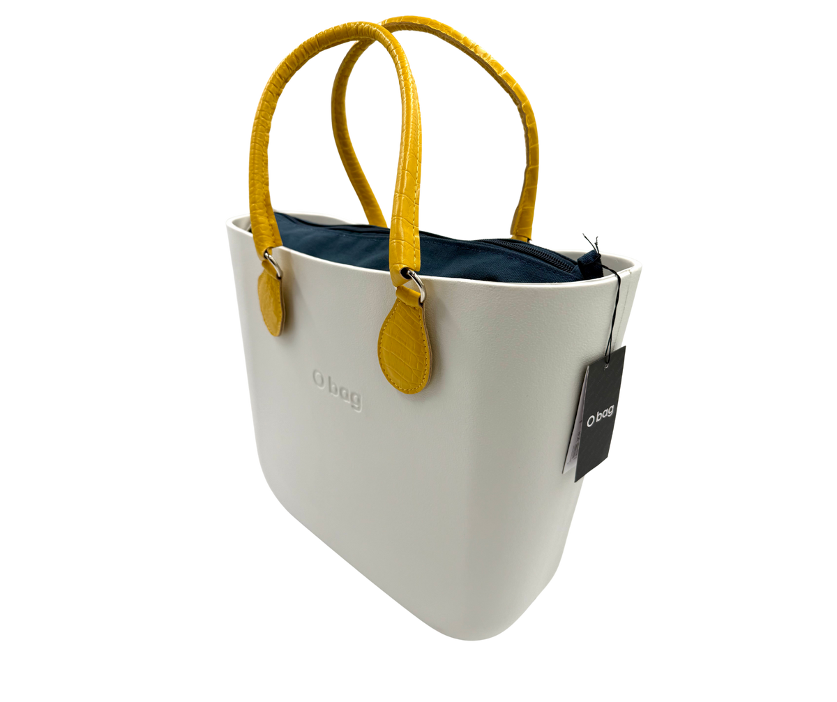 Obag mini bag in snow-white with mustard yellow handles, perfect for women's fashion and designer clothing.
