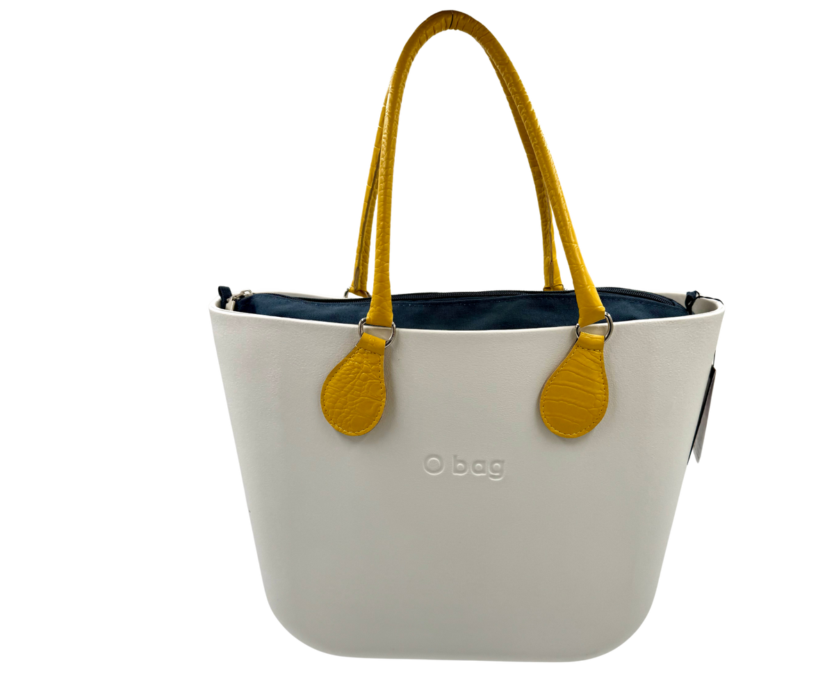 Obag mini bag in snow-white with mustard yellow handles and dark blue insert, perfect for women's fashion and premium brands.