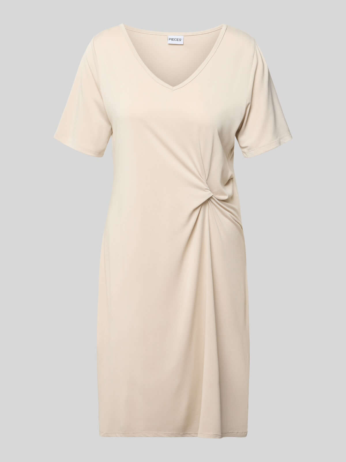 Pieces Pcanora Short Dress in beige, elegant women's fashion with a V-neck and side twist-knot detail.