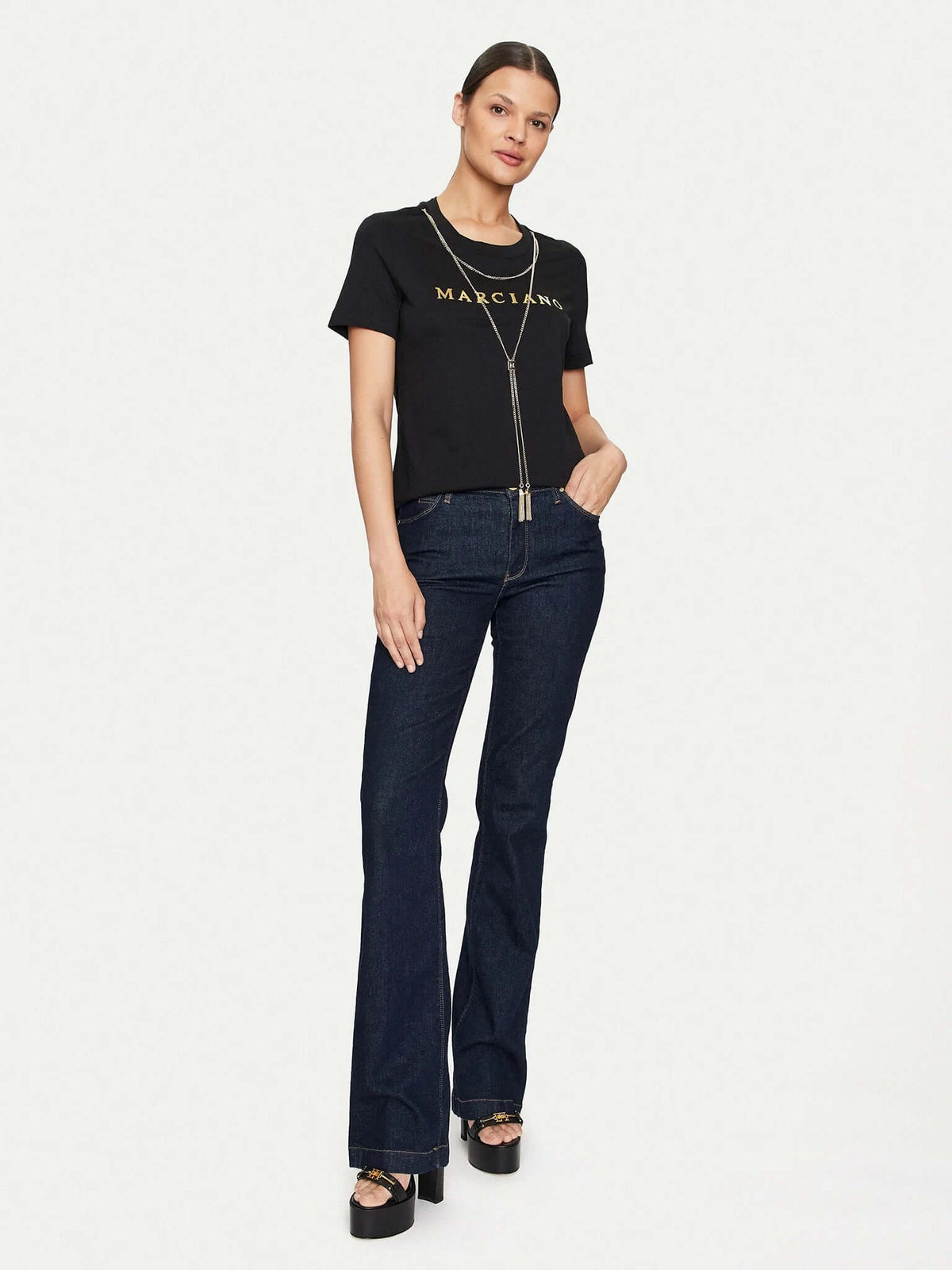 Marciano by Guess Logo T-Shirt with Gold Chain Necklace – Black, stylish women's fashion top with gold logo, paired with flared jeans.