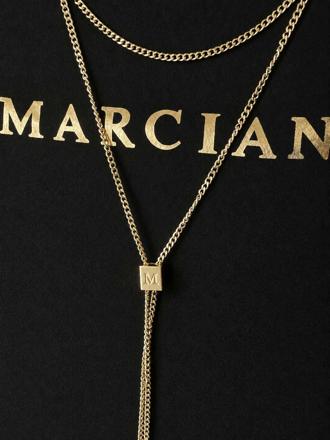 Marciano by Guess Logo T-Shirt with Gold Chain Necklace – Black close-up of gold chain and logo for women's fashion outlet.